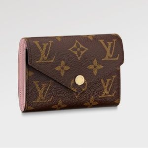 Authentic Louis Vuitton Compact Victorine Wallet in Monogram Canvas.